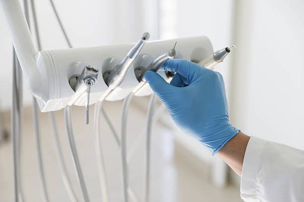 Professional Tooth Extraction technician working in Fairfax city County, VA